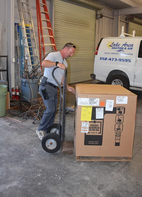 Lake Area Heating & Air technicians working together on a job site