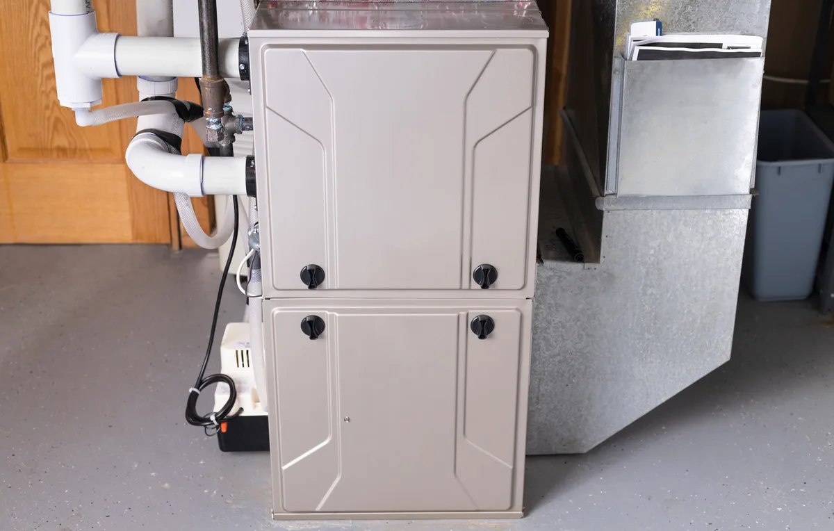 Upflow gas furnace installed in a home utility space