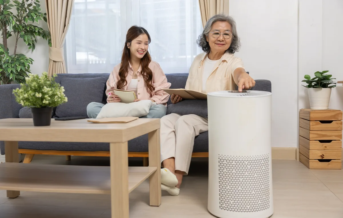 Family at home beside a room air purifier
