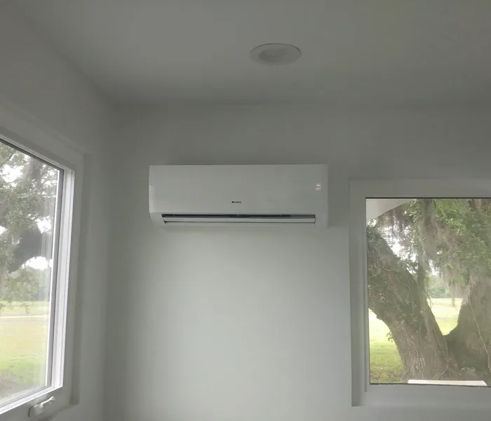 Ductless mini-split indoor unit mounted high on a wall