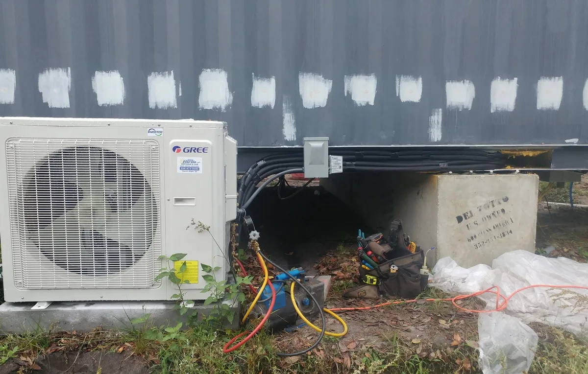 Gree outdoor unit installed beneath a modular home