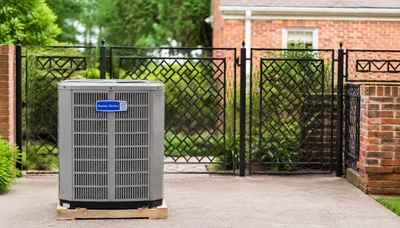 Outdoor central air conditioning condenser unit installed beside a Keystone Heights home